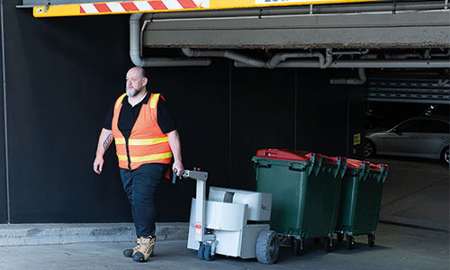 Tug rise towing bins on ramps